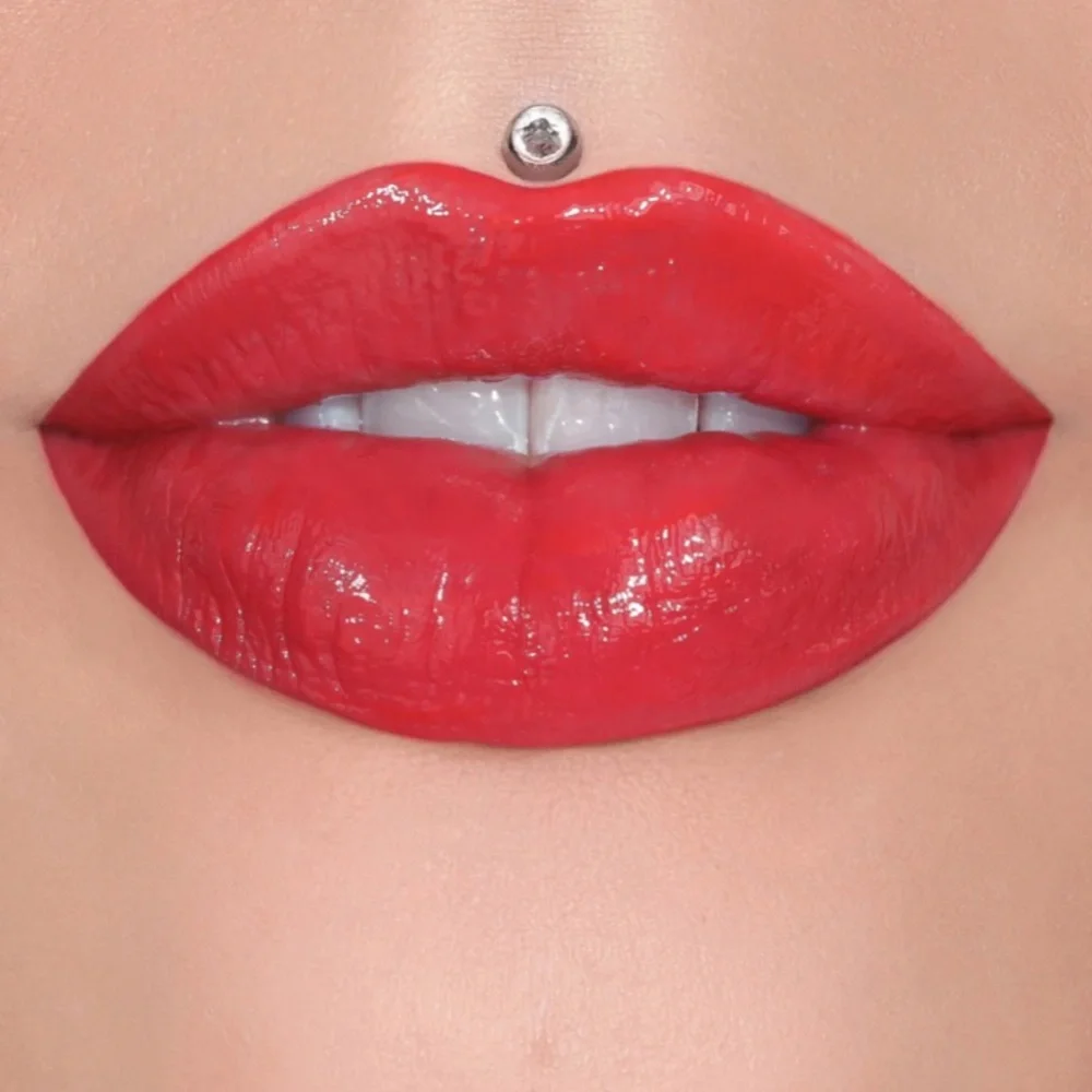 Jeffree Star Supreme Gloss 2003 (peachy orange-red)/ vanilla cupcake scent / NIB